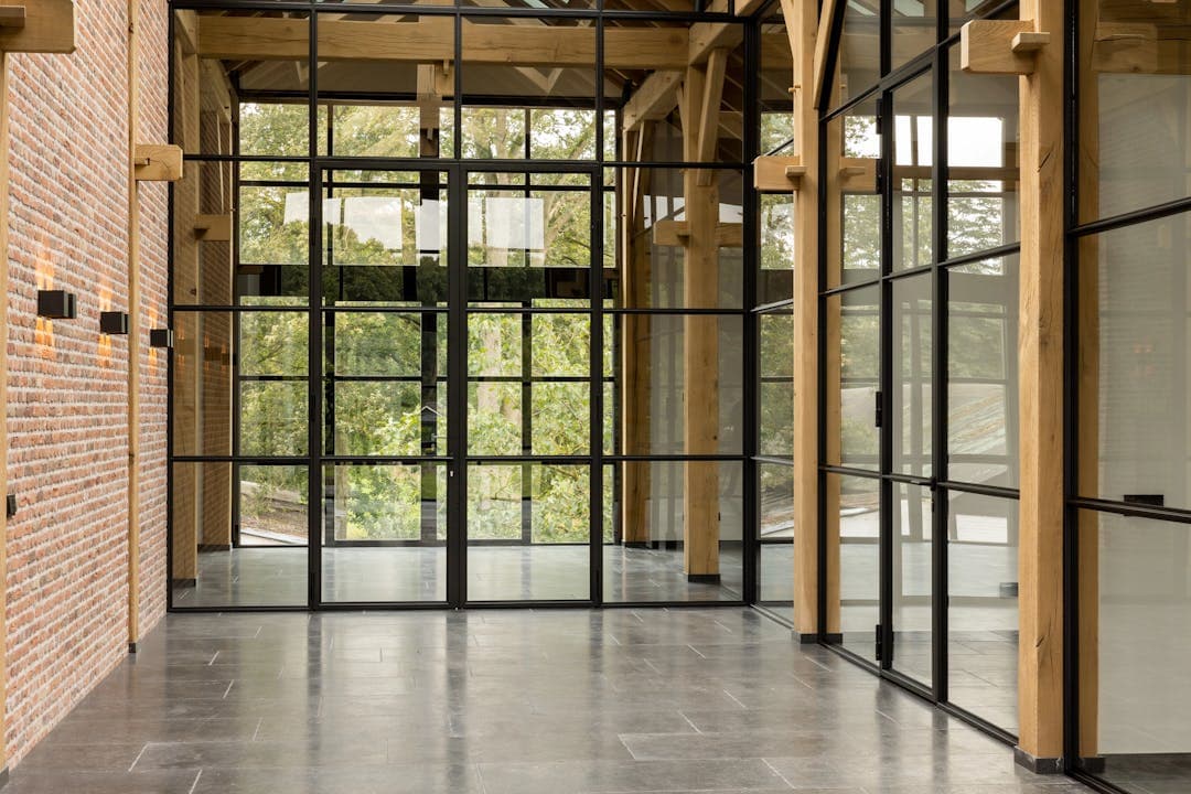 hinged fire-rated steel glazed doors in an office