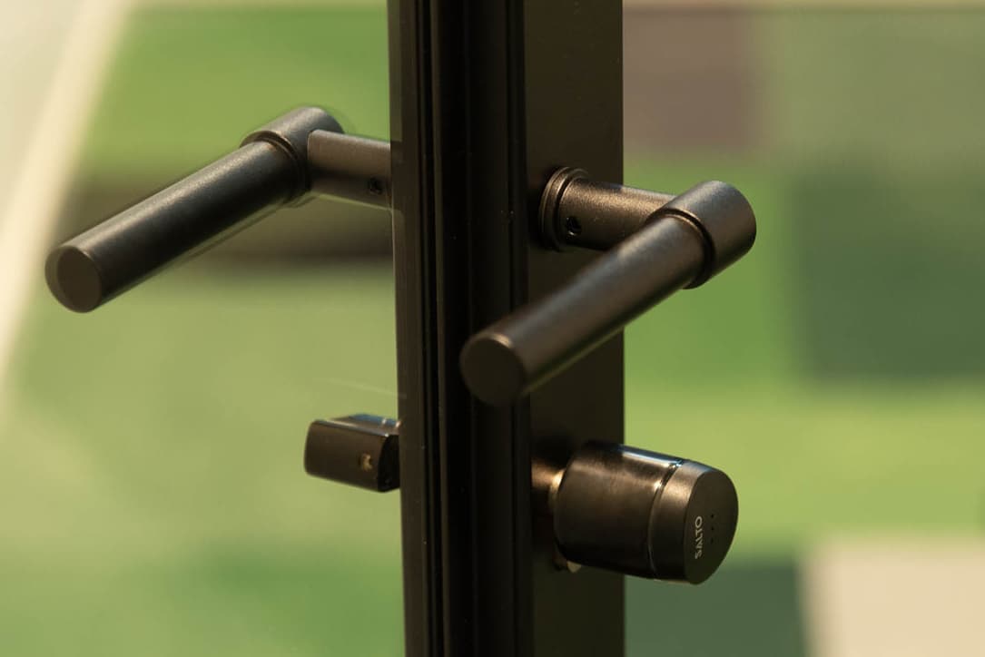 Piet - G5XL Handle - a lever handle for a steel-glazed door in a black powder coat finish