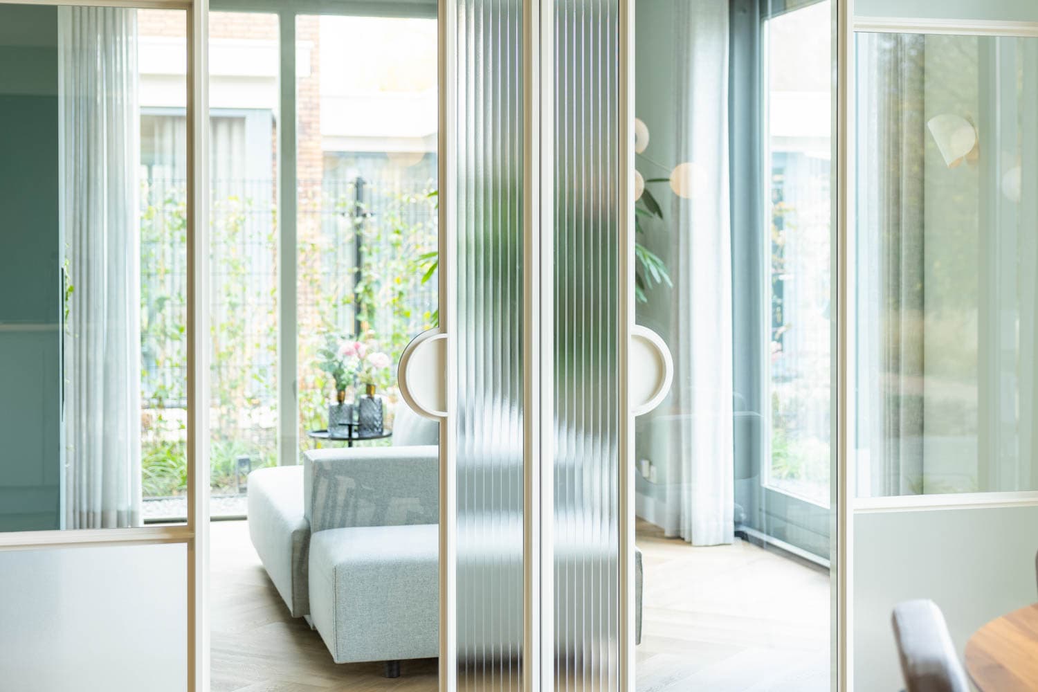 white steel glazed sliding doors used as a room divider in a high end private residence