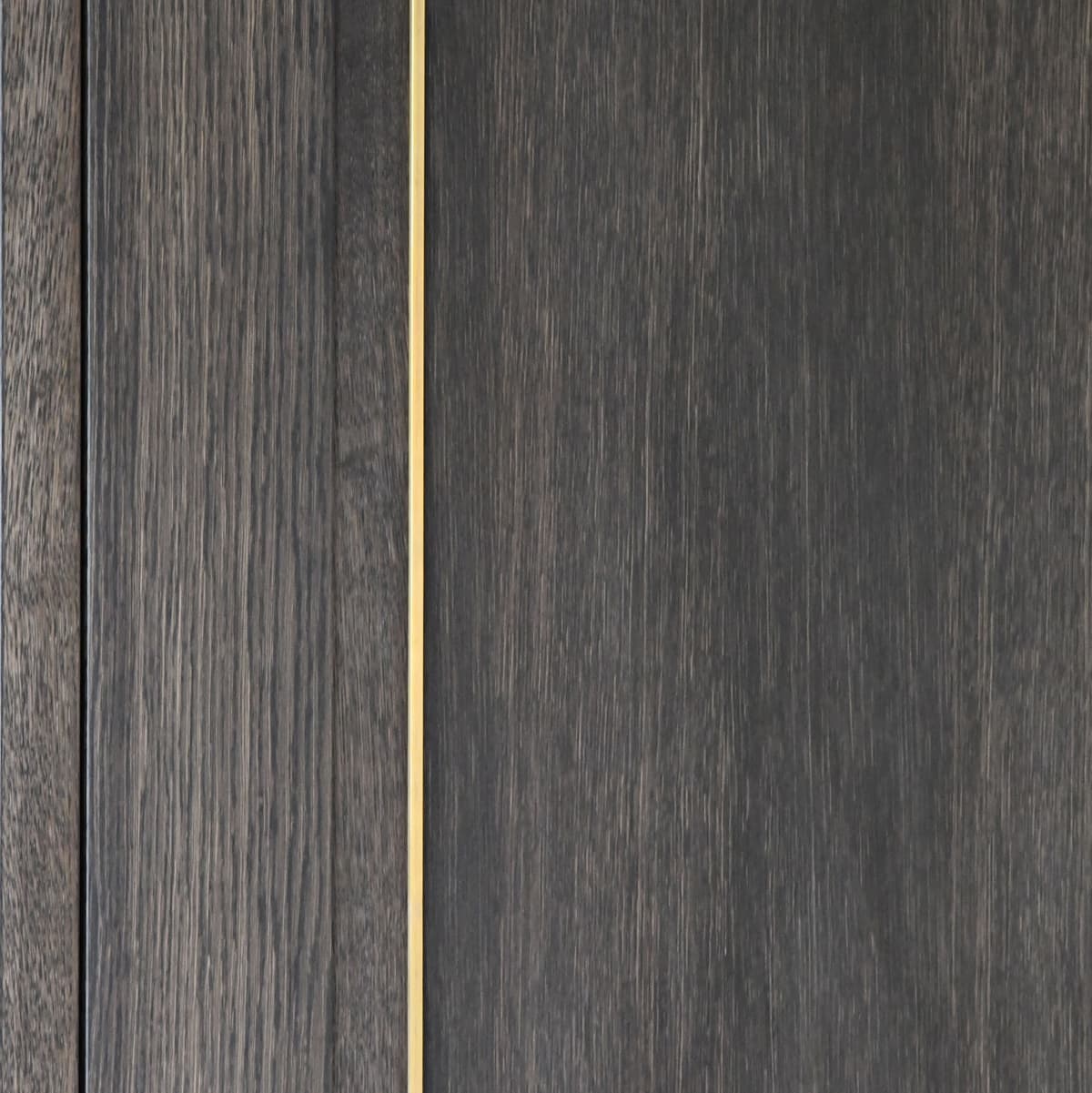 timber veneer - dark oak with metal inlay in a brass finish