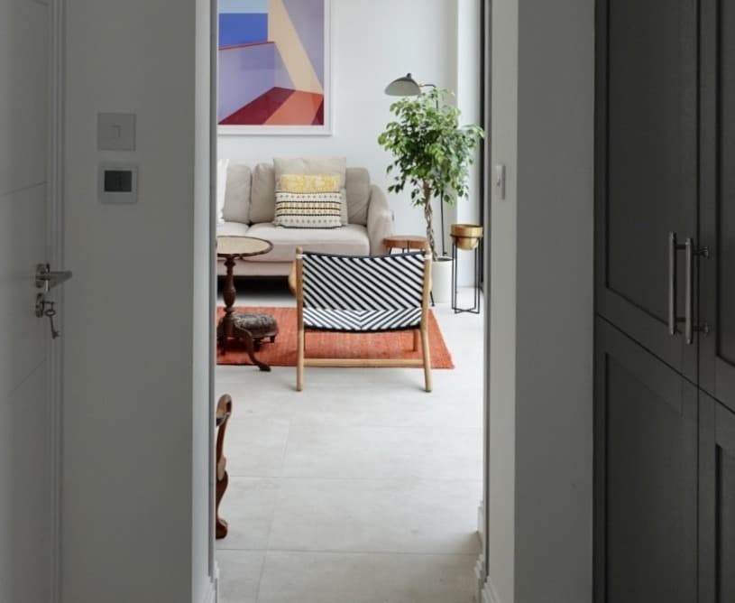 sliding pocket door separating a utility room and garage from a family living space