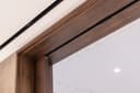 Track detail of a set of fully open double sliding pocket doors